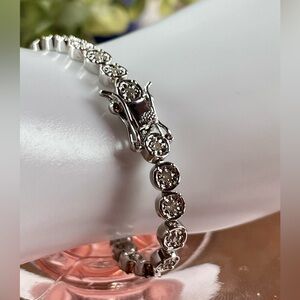 1CT GENUINE • / platinum over brass Bracelet. 7"